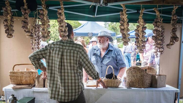 Man at a garlic stall.