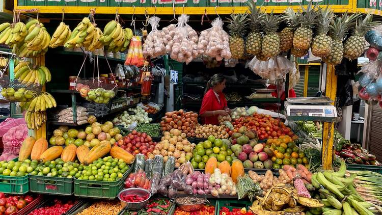 Colorful fruit and vegetables stall at local farmers market Plaza Minorista in Medellin, Colombia