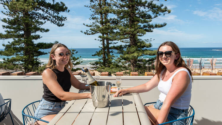 Two girls on the rooftop at Hotel Steyne