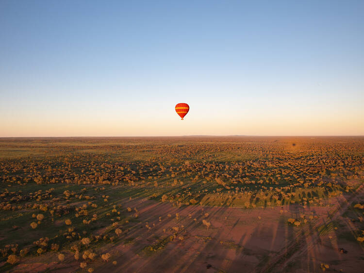 Witness the sunrise from a hot air balloon