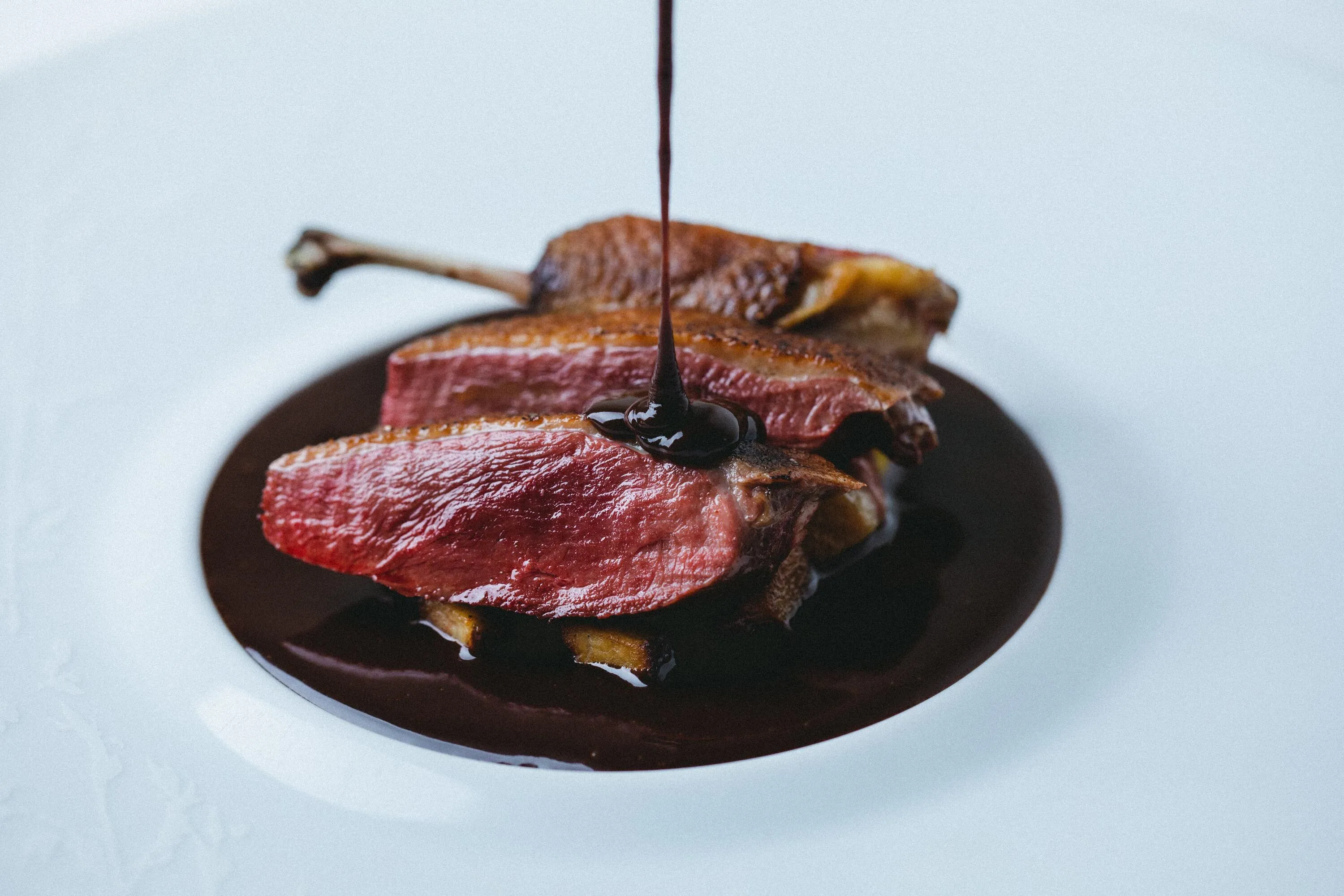 Roast mallard duck with salmis sauce at Lature