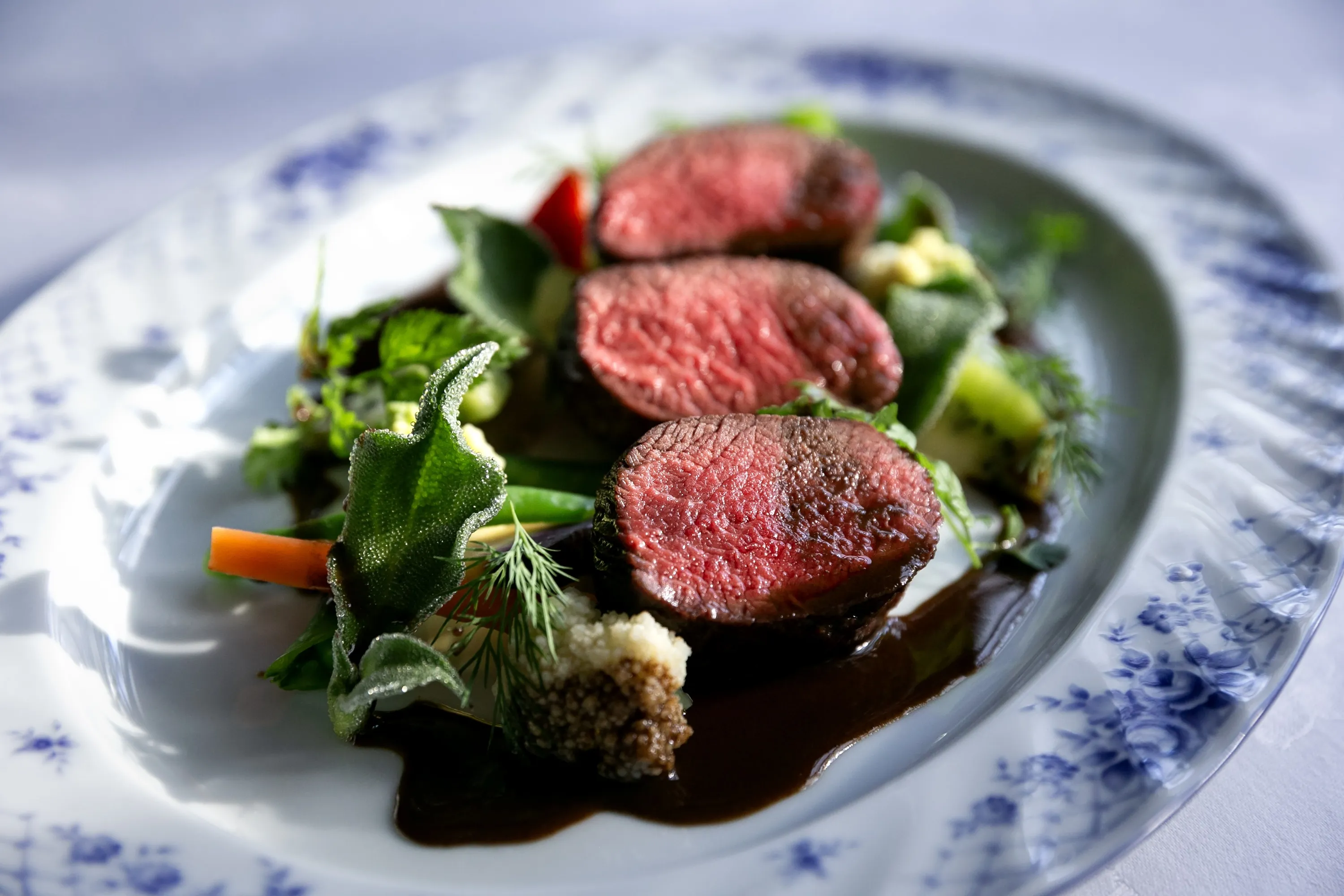 A serving of venison steak and vegetables by chef Norihiko Fujiki