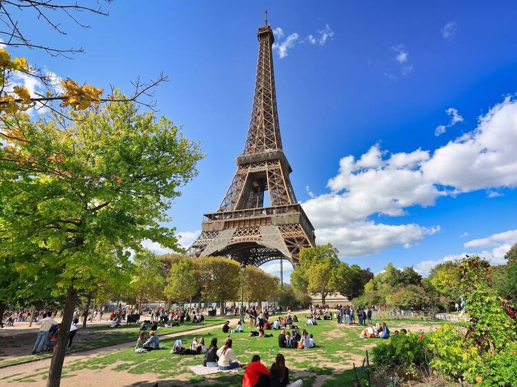 People on the walk at Park Champ de Mars by the Eiffel Tower in Paris. France