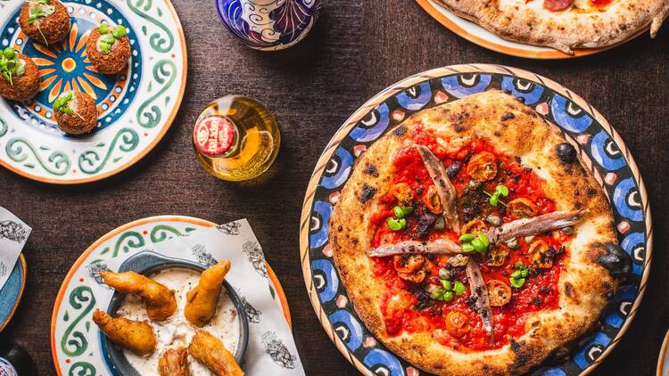 Pizza with anchovies and Italian tapas 