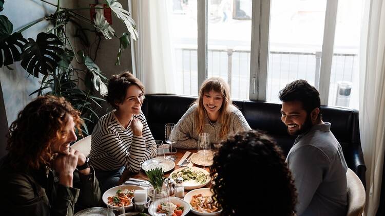 Group of people meeting over dinner