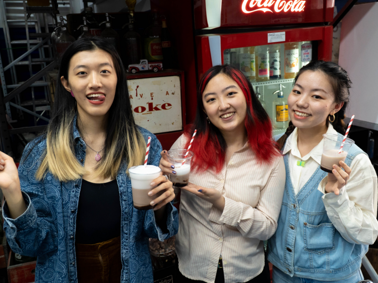 Three women drink egg creams at SeltzerFest.