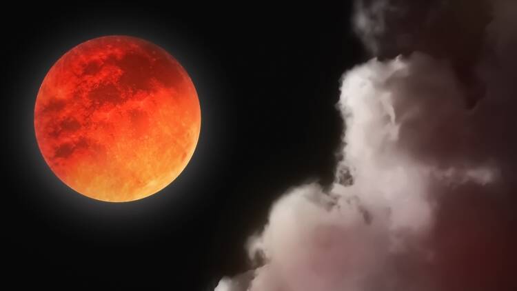 Blood moon eclipse in the night sky