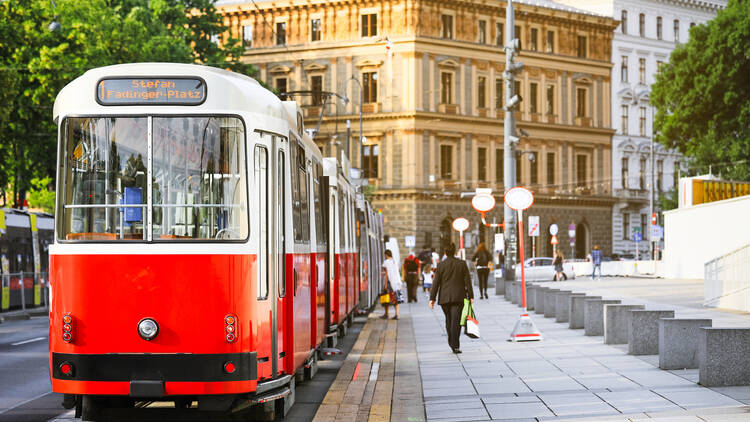 Old fashioned tram goes by the street of Vienna