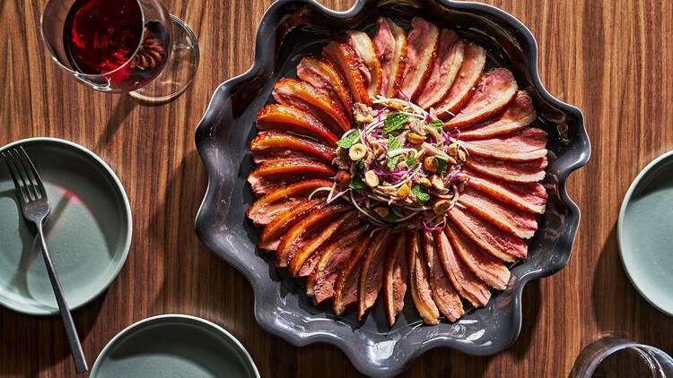 A bowl of thinly sliced duck