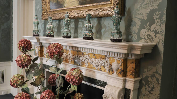 The Frick Collection breakfast room mantle with ceramics on it