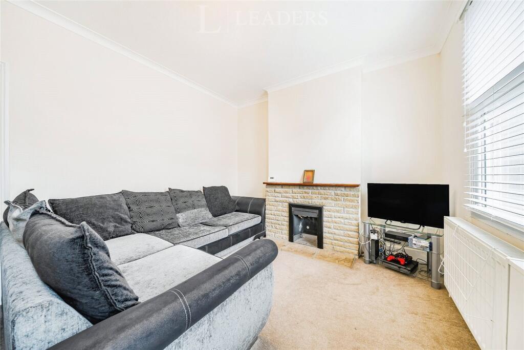 Simple living room in a terraced house in Bromley