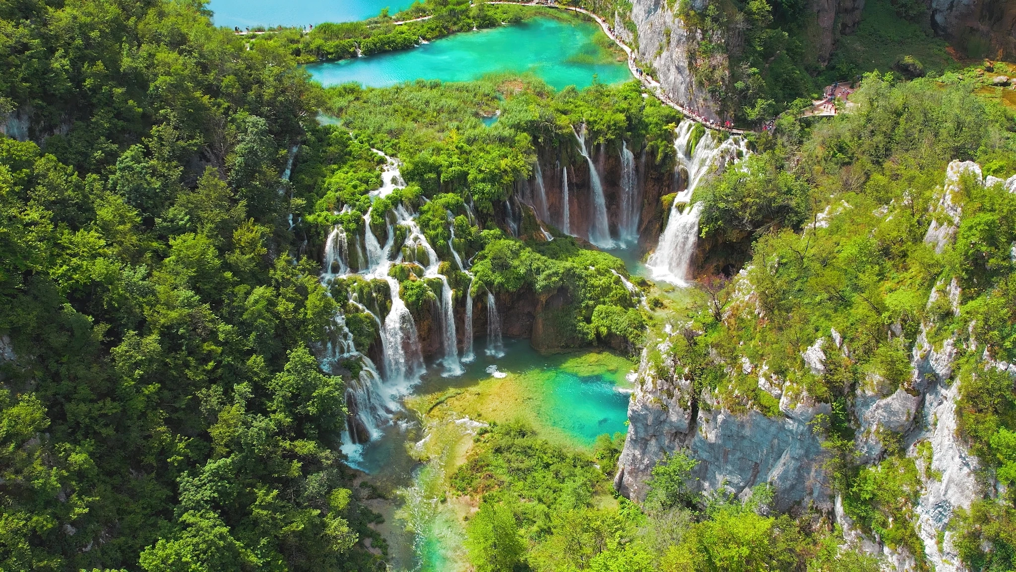 Plitvice Lakes National Park in Croatia. Summer mountain landscape with streams with emerald green water and waterfalls.