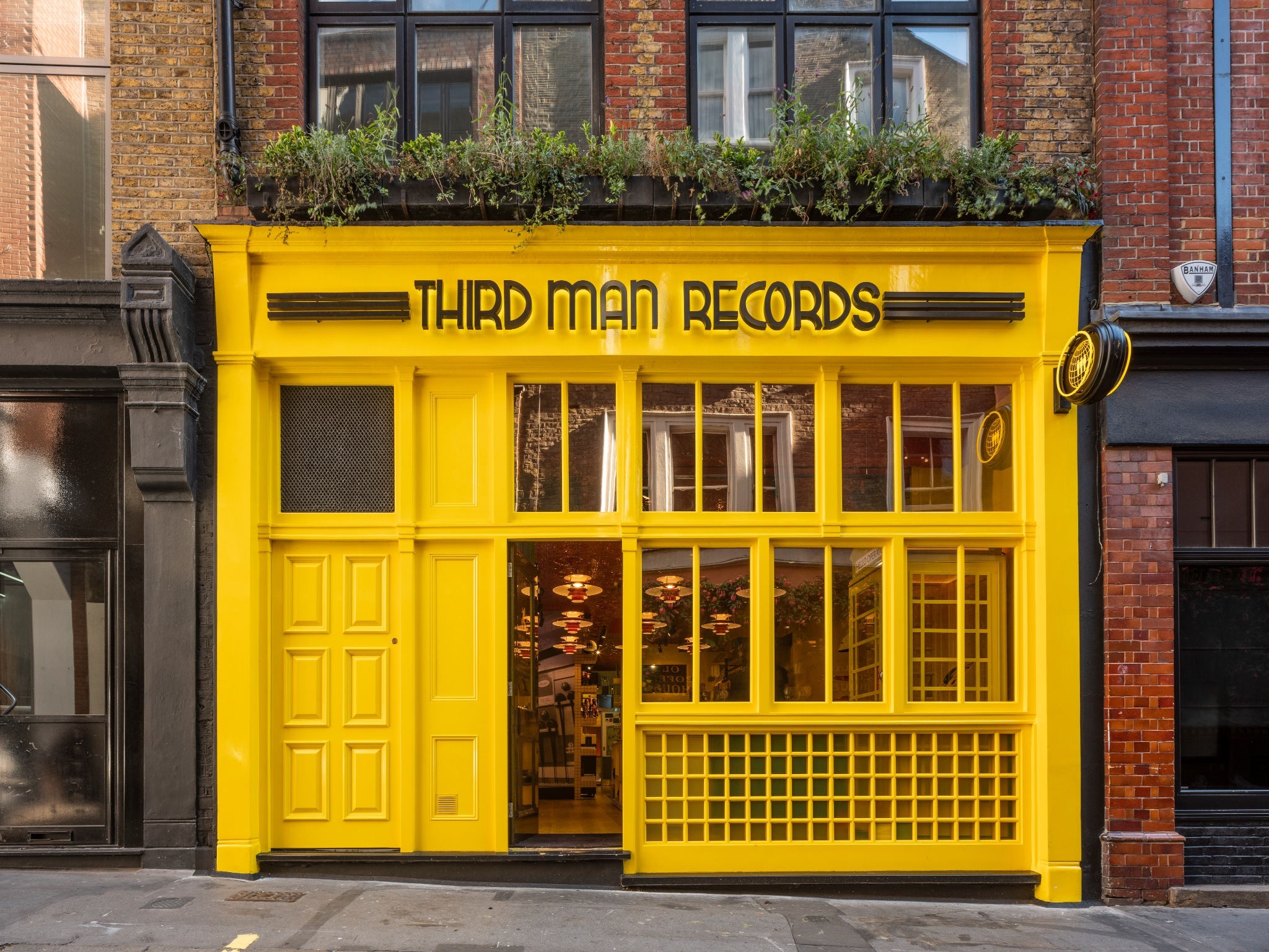 Bright yellow shopfront of Third Man Records in Soho