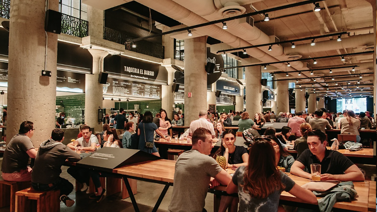 Inside Time Out Market Boston with tables full of people
