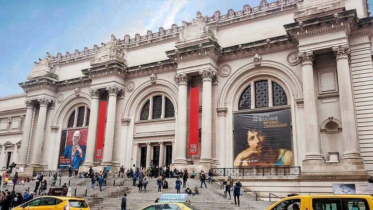 outside metropolitan museum of art, stairs and front of building