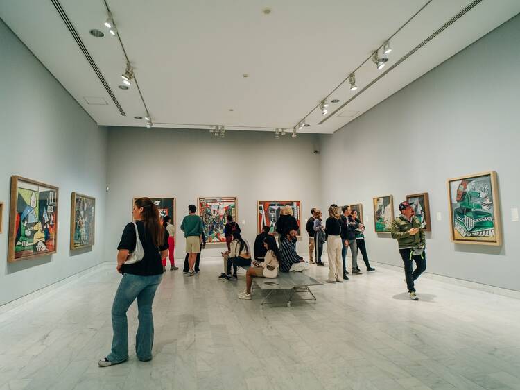 people looking at paintings at the Picasso Museum. High quality photo