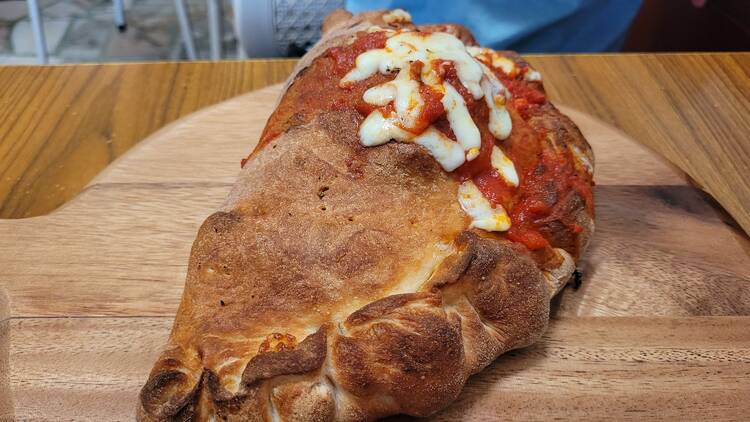 Calzone on a wooden board