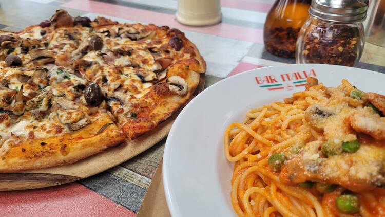Pizza and pasta on a table