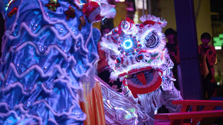 An illuminated dragon puppet.