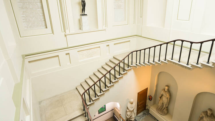 Stair hall classic style with gold chandelier,Ashmolean Museum,UK