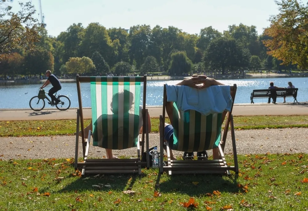People on deckchairs in sunshine