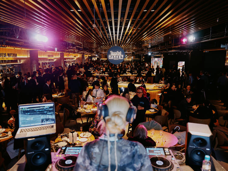 A DJ playing to the crowd at Time Out Market Osaka