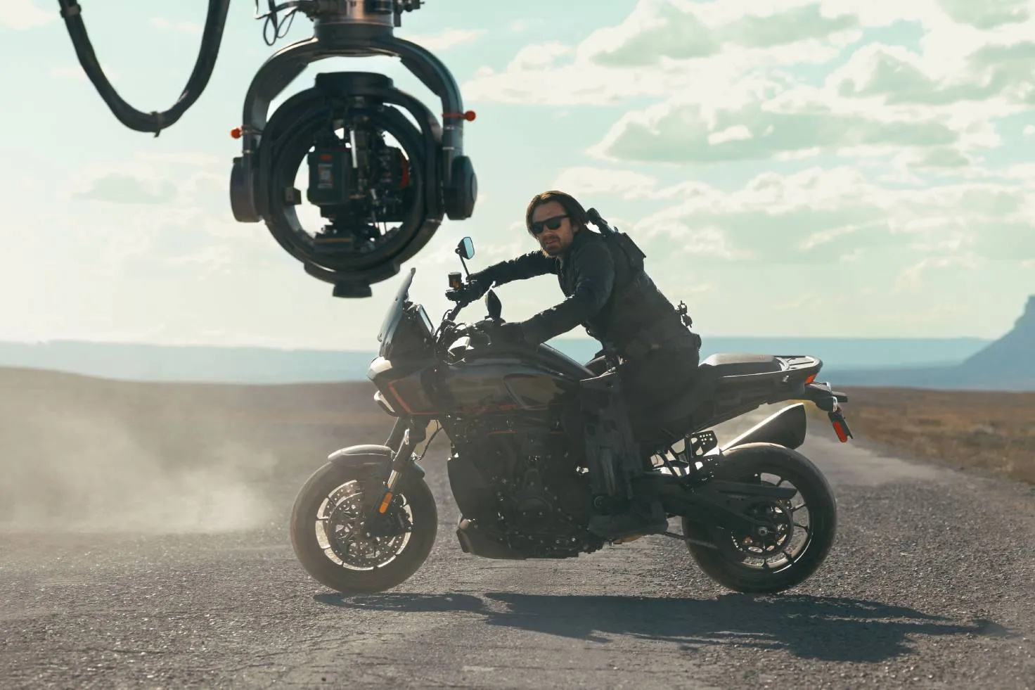 Sebastian Stan in action as Bucky on a Utah road