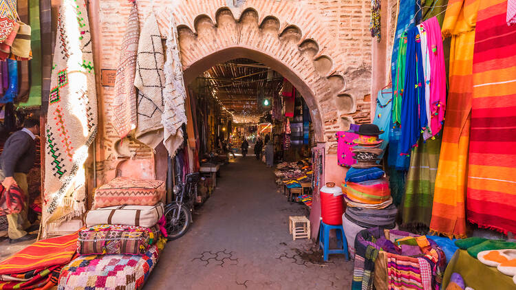 Marrakech souks with colourful rugs