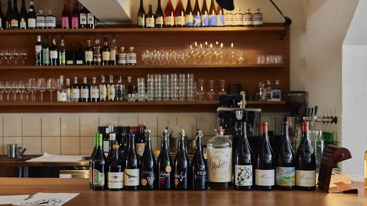 Bottles of wine lined up at Clover.