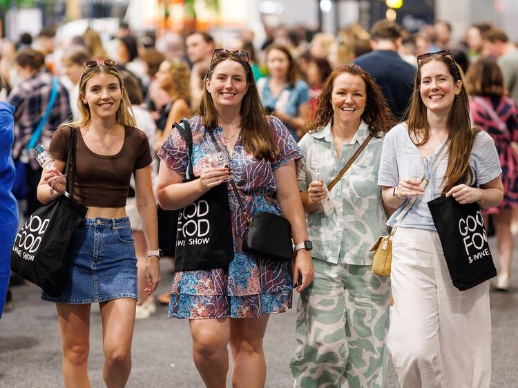 Four women walking through the Good Food and Wine Show.