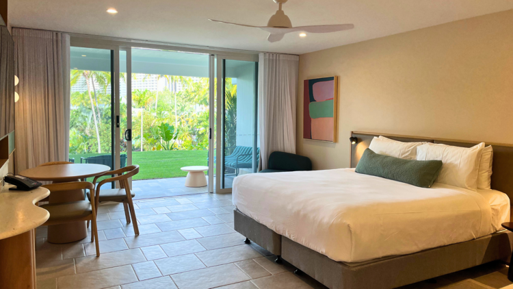 Hotel room with bed and garden views