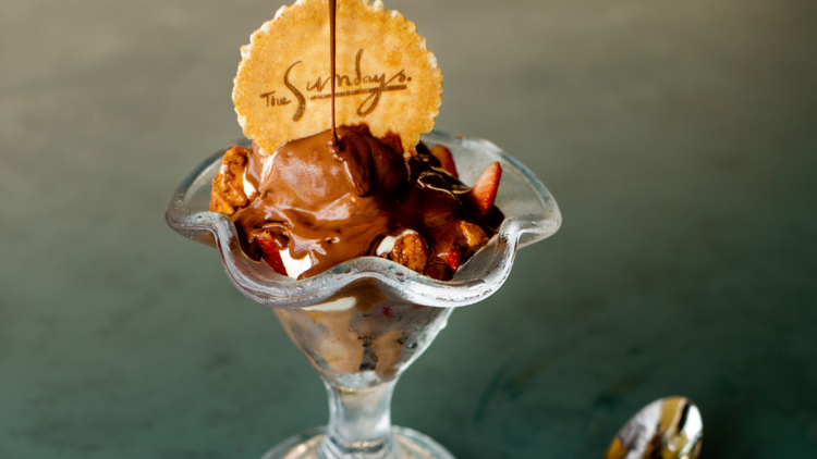 Ice cream sundae with wafer and chocolate sauce