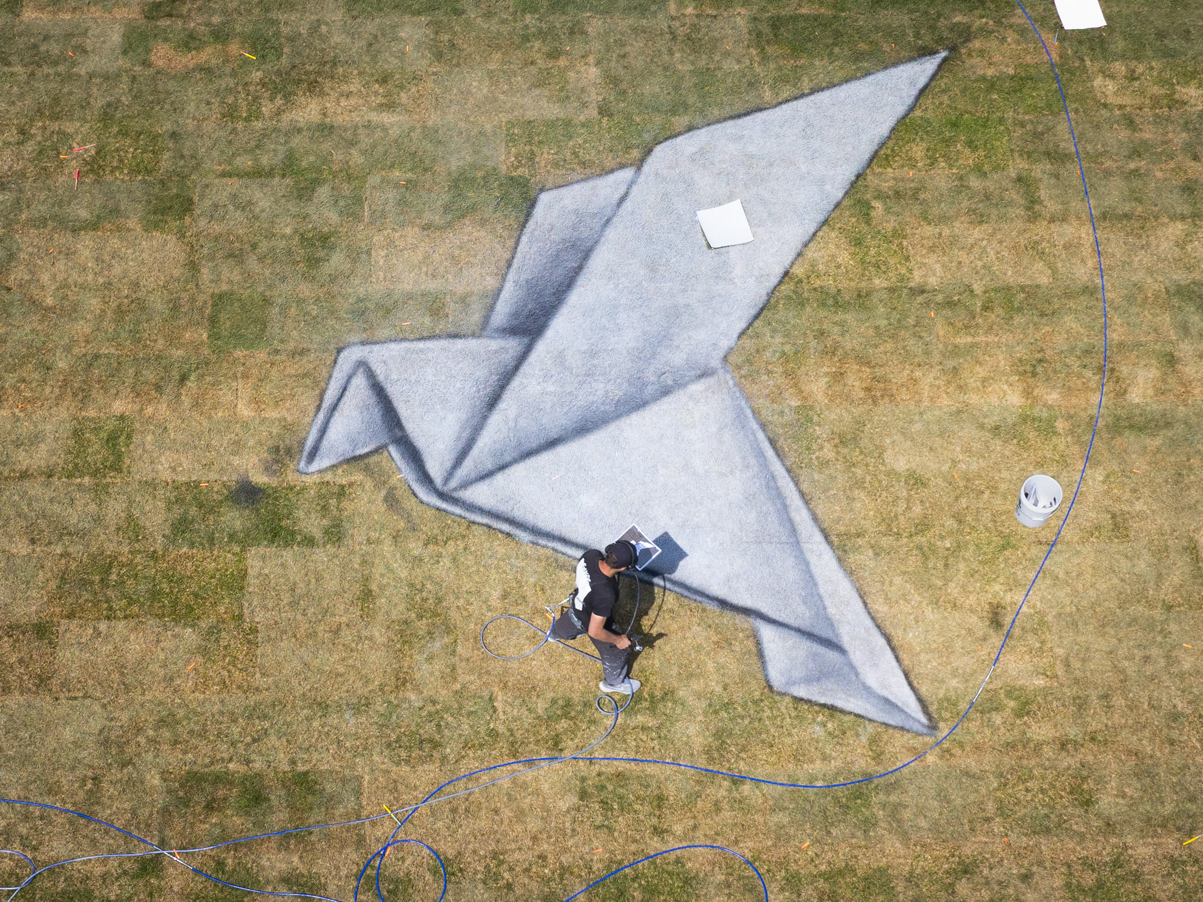 Saype’s Address Hate mural being painted in NYC