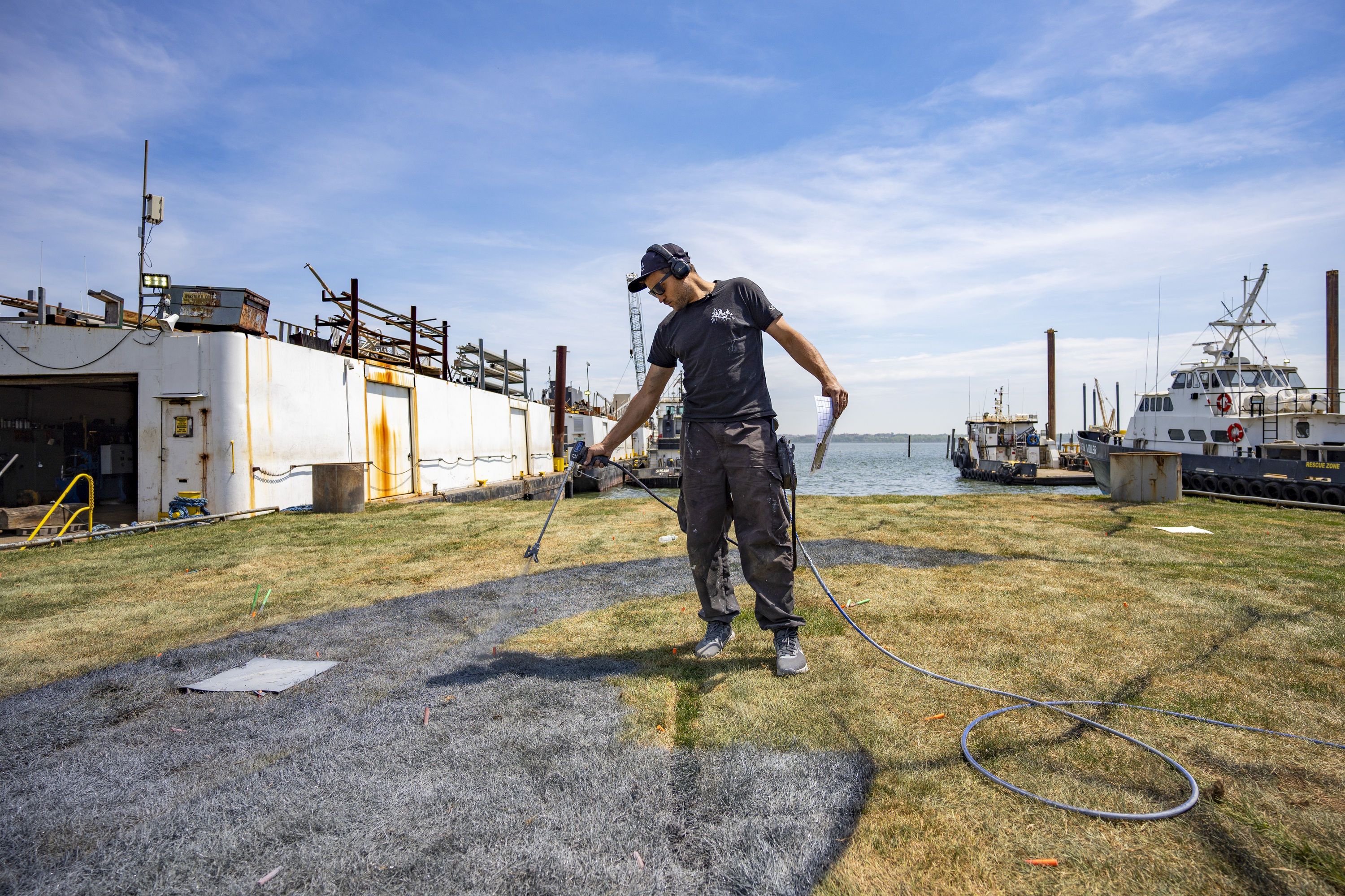 Saype painting his mural in NYC