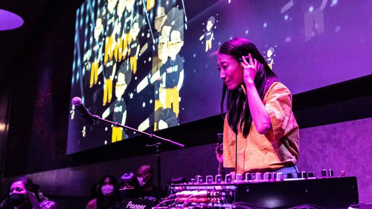 DJ at her turntable DJ at her turntable
