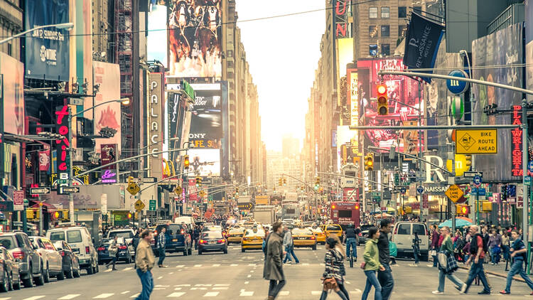 Pedestrians walking through Times Square