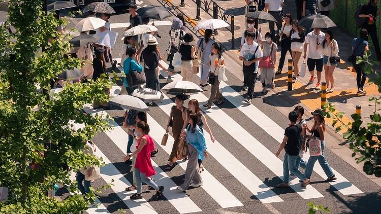 People walking on crosswalk Tokyo city street