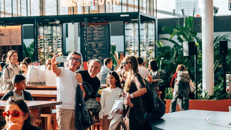 A group of people taking a selfie at Time Out Market Barcelona