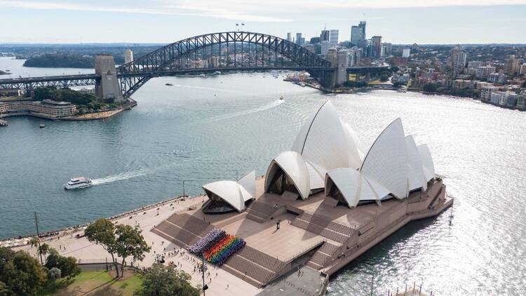 Sydneysiders created a human Progress Flag on the steps of the Sydney Opera House.  