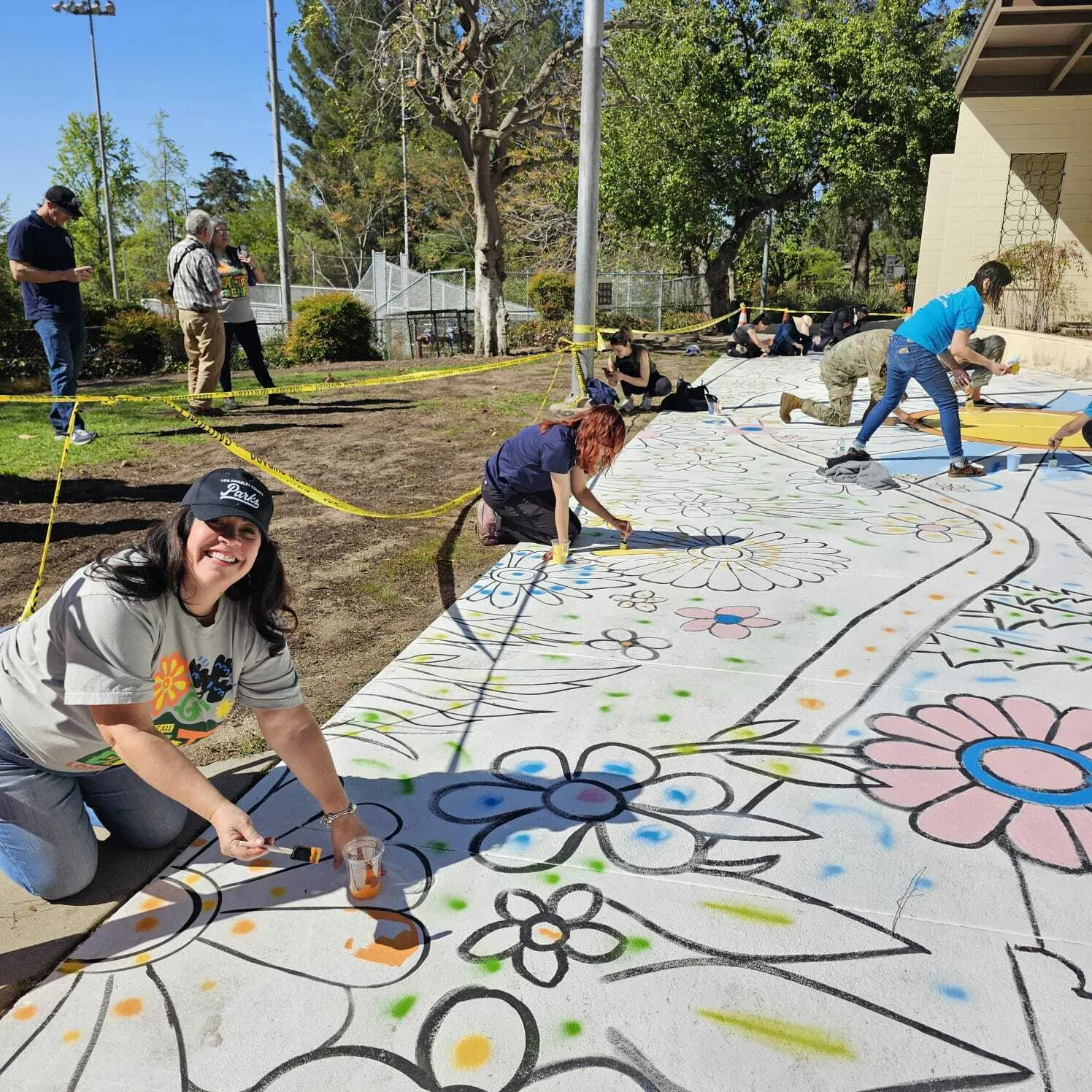 Norma E. García-González painting at Loma Alta Park.