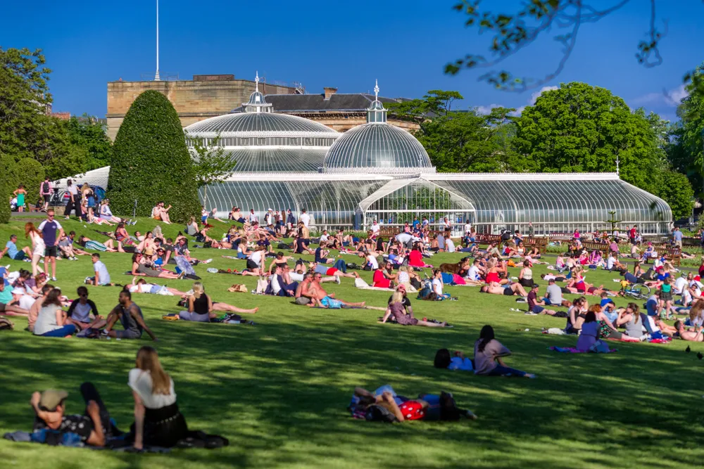 Glasgow park with crowds in the sunshine
