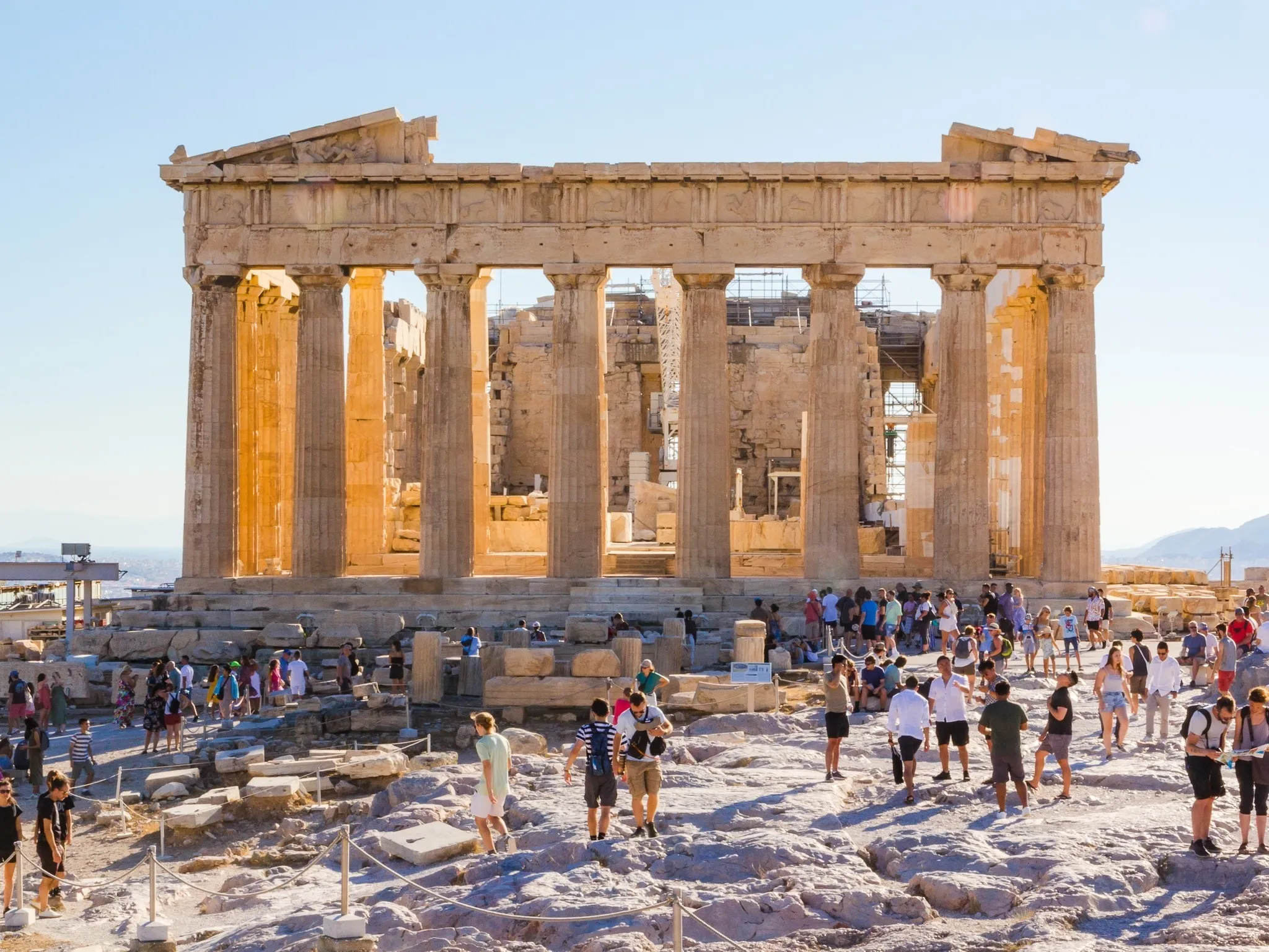 Crowds of tourists visit the Parthenon in the acropolis everyday at sunset