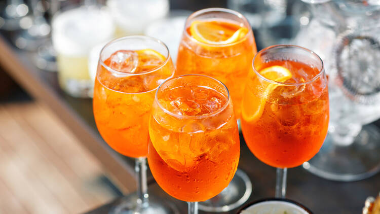 Four glasses of Aperol Spritz