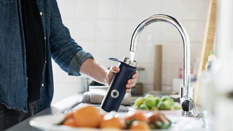 Man filling water bottle