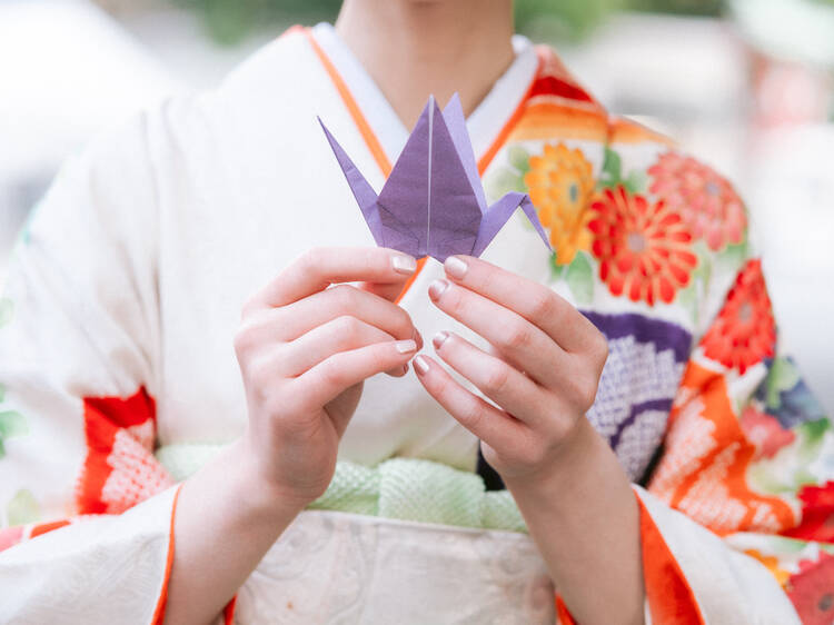 Woman holding origami crane