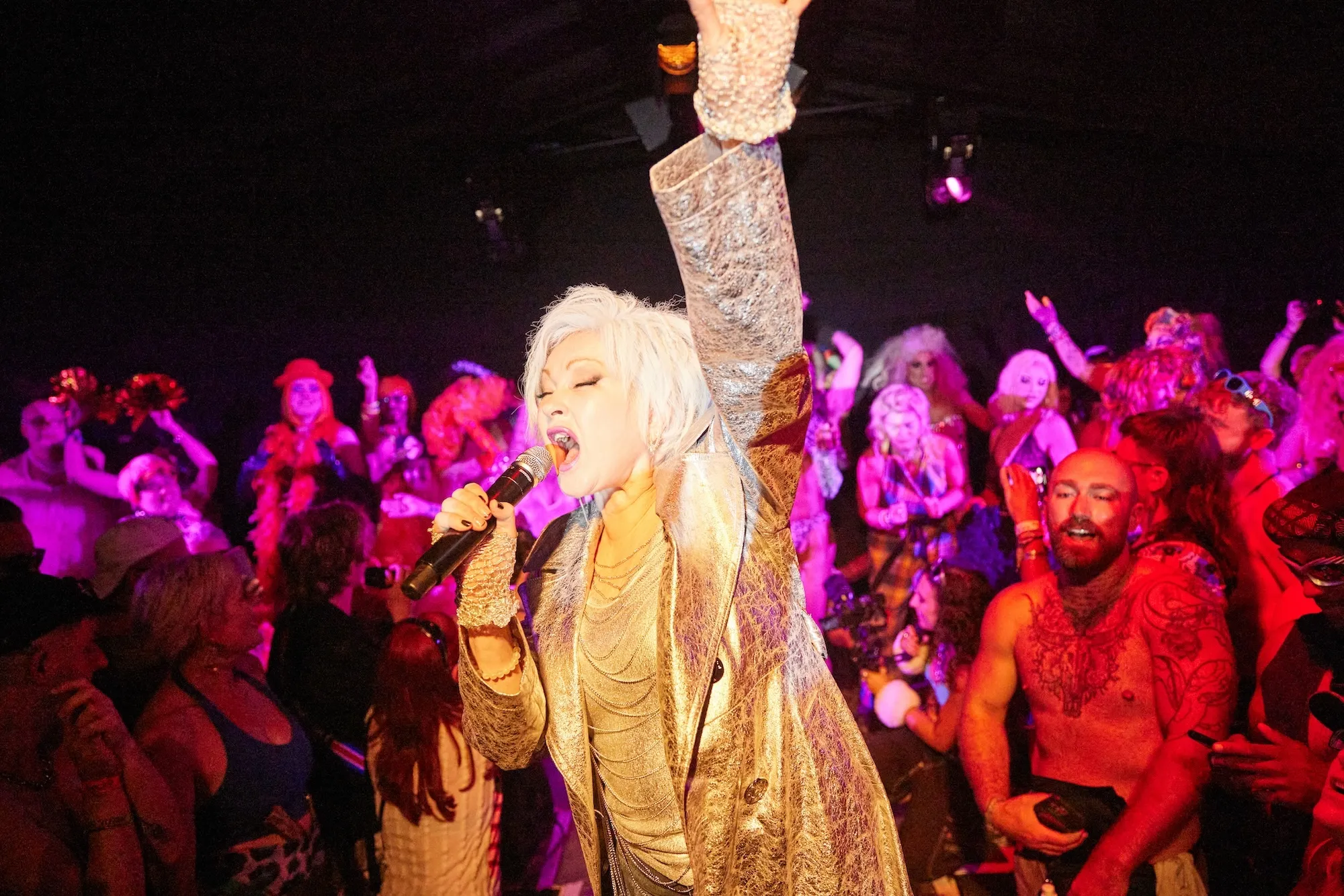 Block9 Glastonbury stage, crowded nightclub with Cyndi Lauper performing in the centre