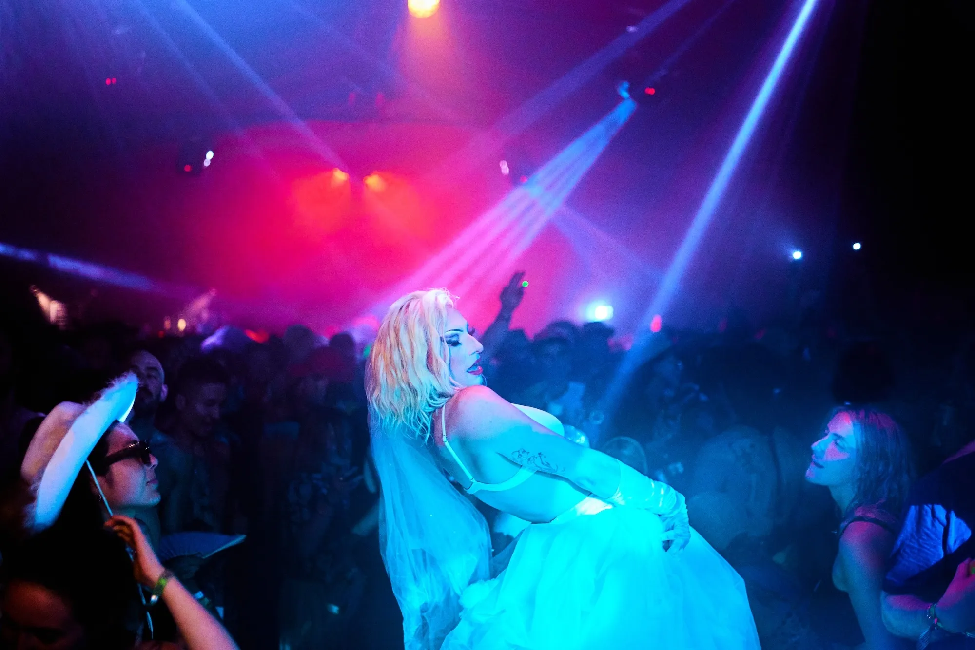 Block9 Glastonbury stage, nightclub dancers performing in drag in a busy nightclub