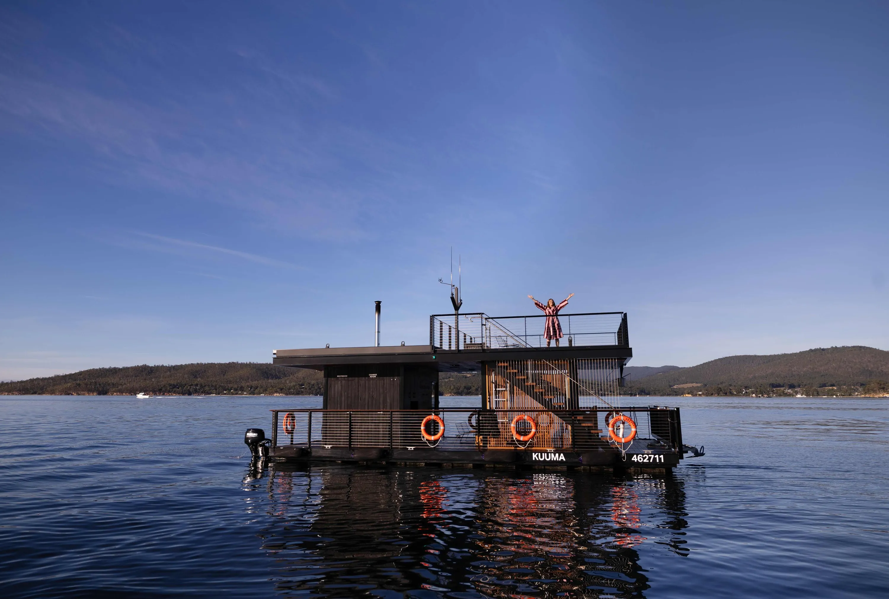 Floating sauna on blue lake