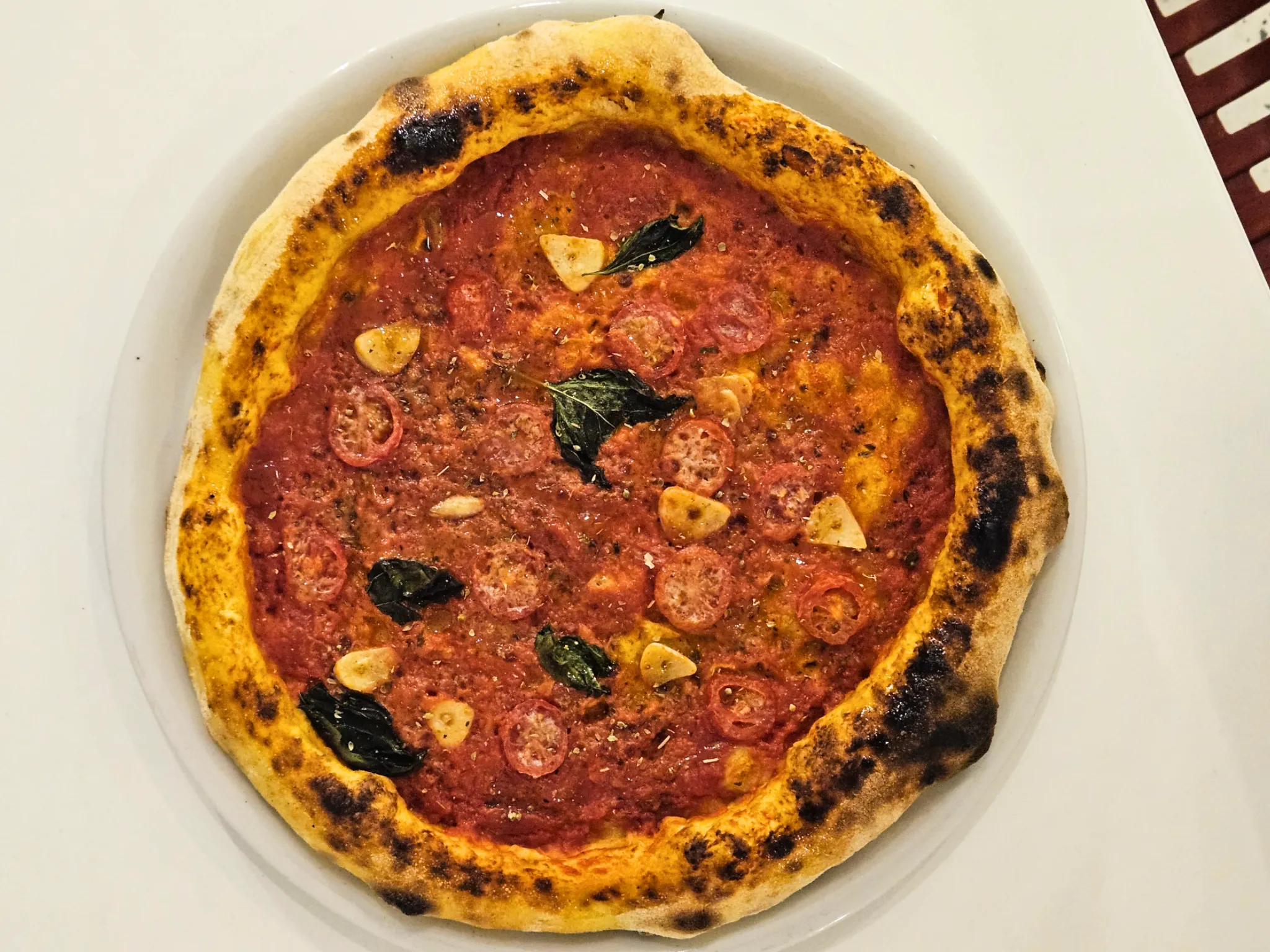Marinara pizza on white plate