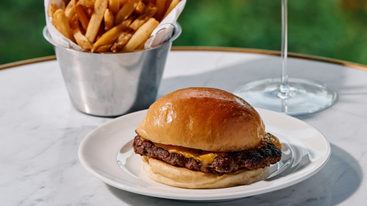 Sit on the terrace at French restaurant Maison Bâtard